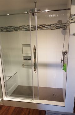 Glass shower door hardware and enclosure example